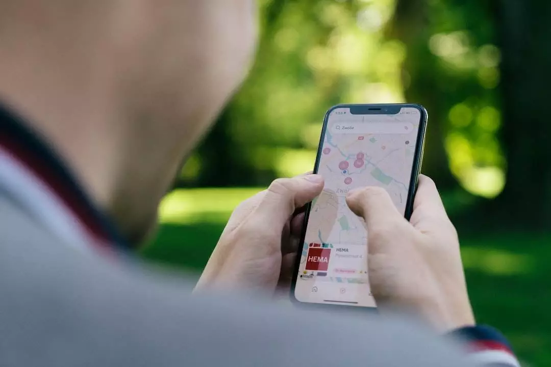 Person using navigation app on smartphone outdoors