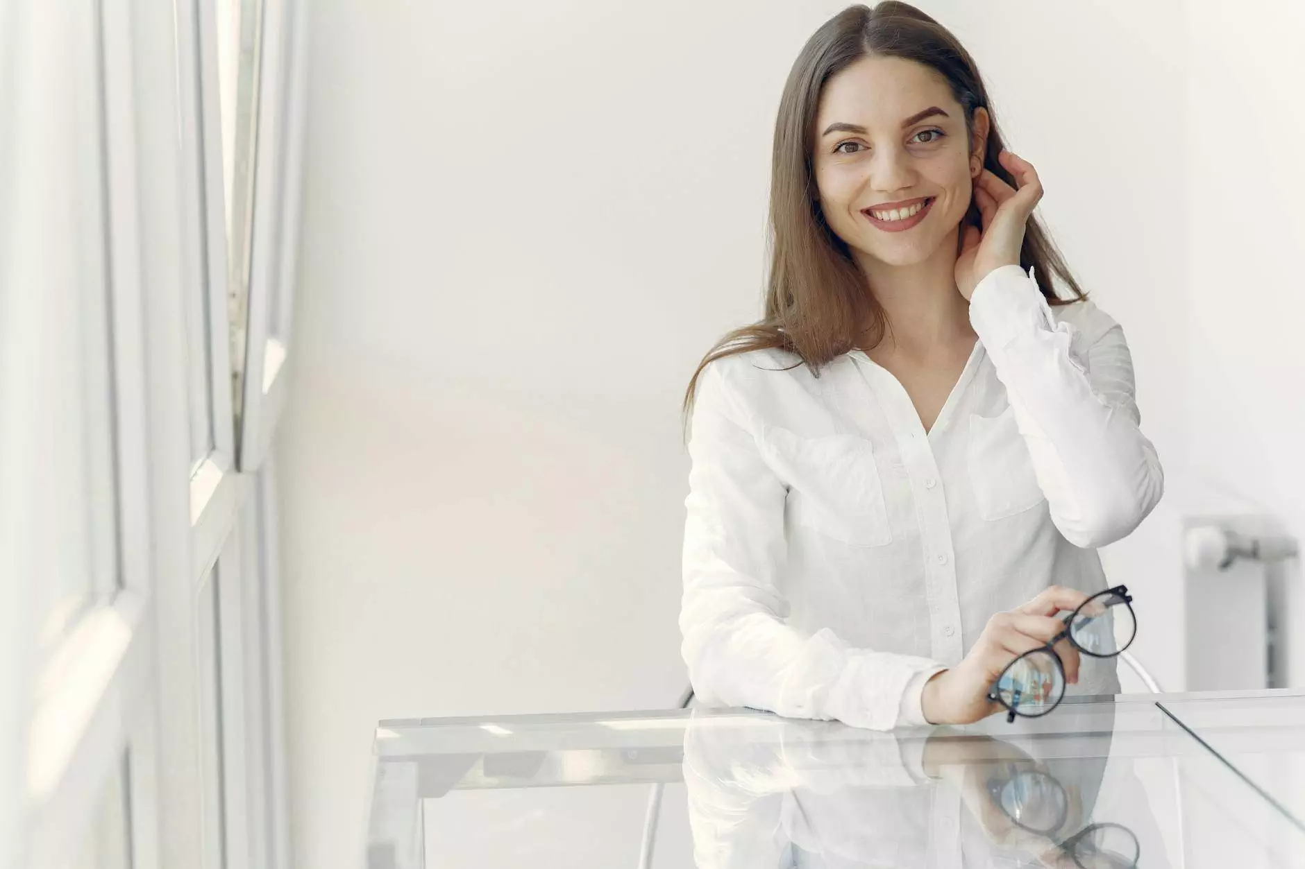 smiling young lady with glasses in office