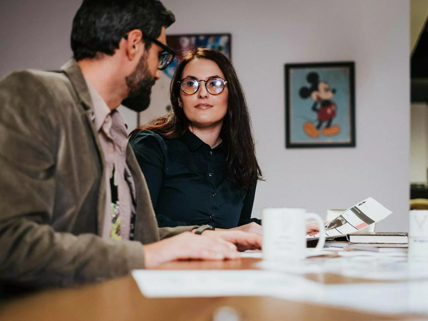 business analytic talking to woman in office