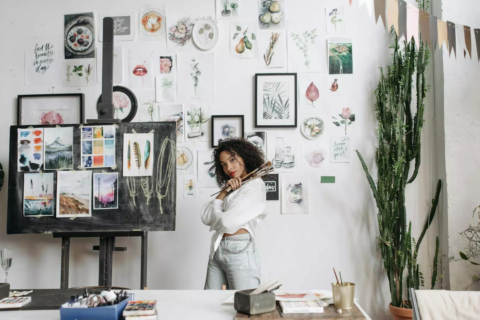 woman standing in art studio against paintings