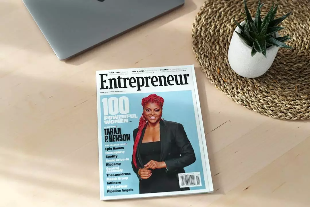 Magazine on desk featuring influential woman entrepreneur.