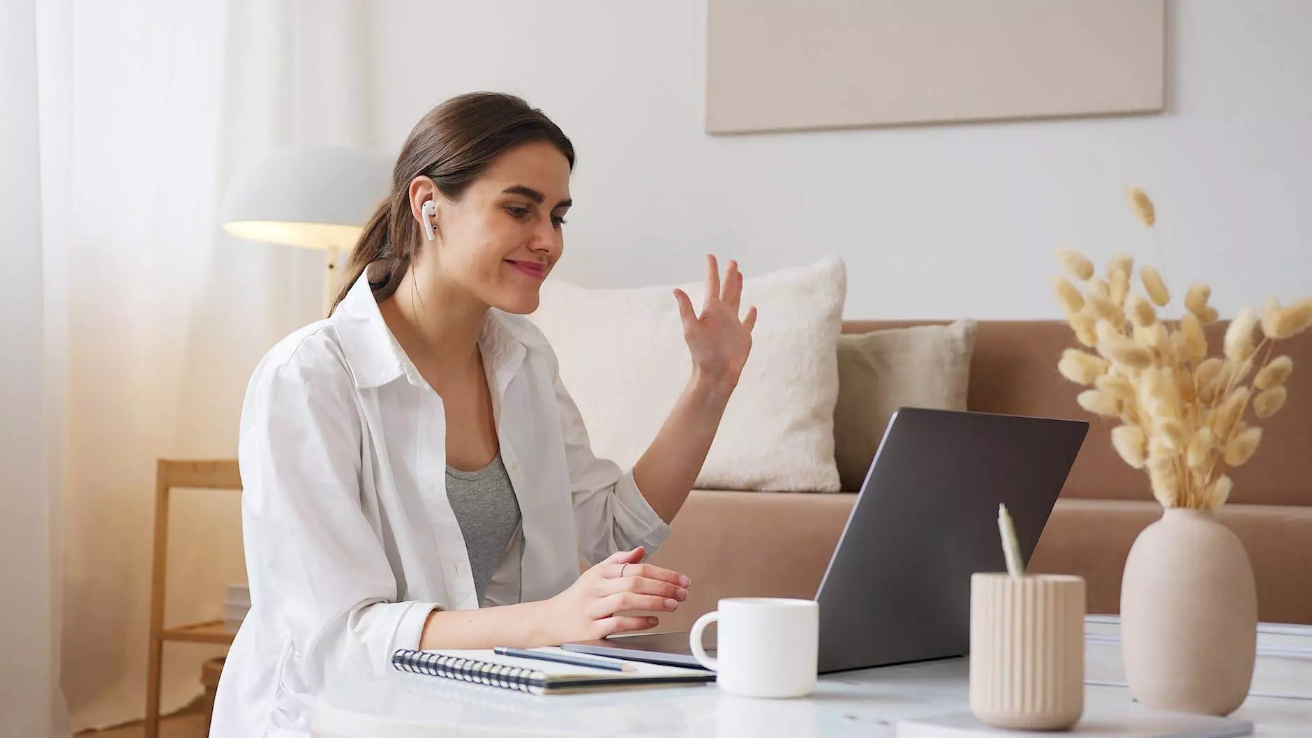 cheerful woman having video call via laptop